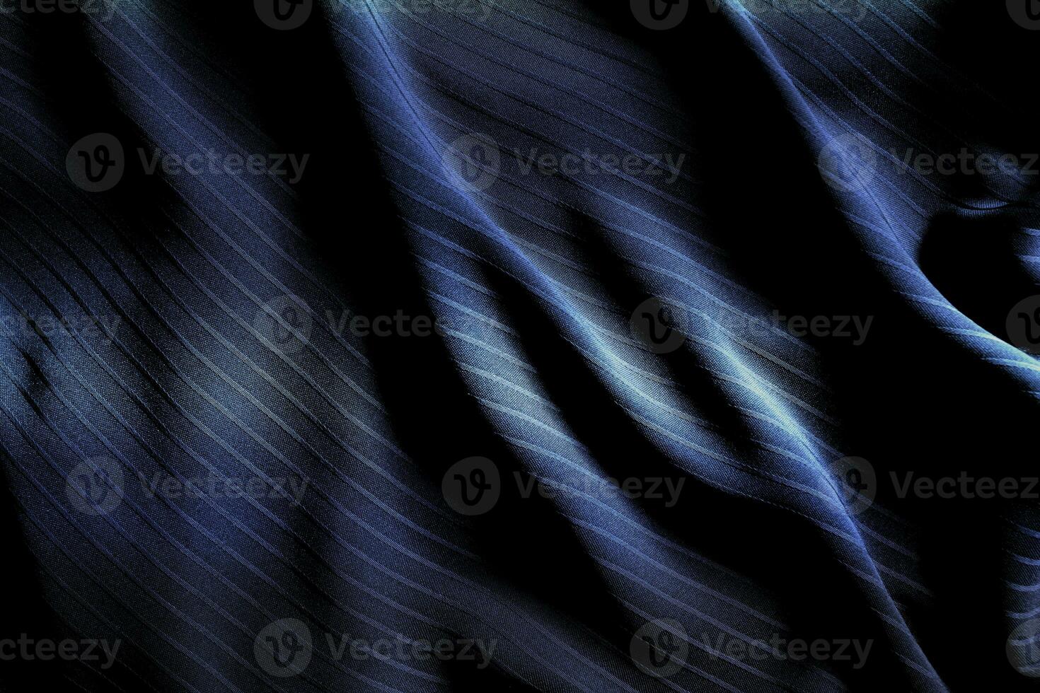 Dark black and gray blurred gradient and line of cloth or fabric background has a little abstract light. photo