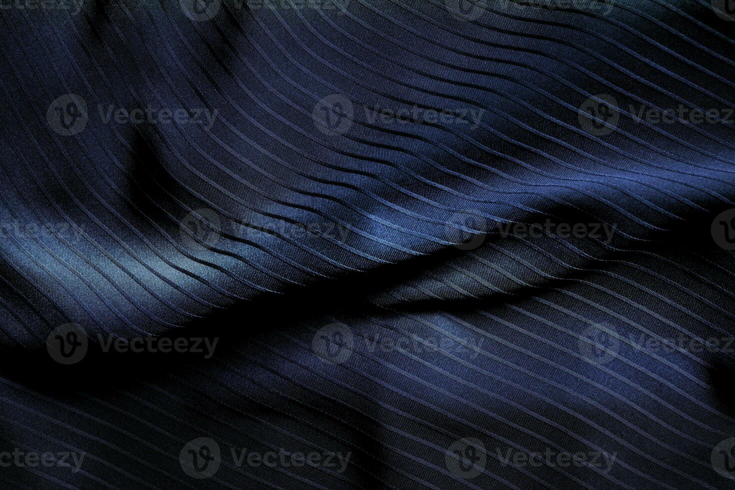Dark black and gray blurred gradient and line of cloth or fabric background has a little abstract light. photo