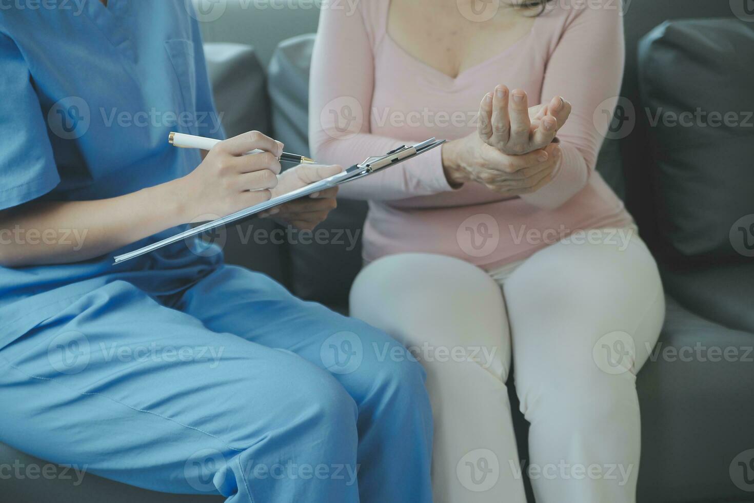 PTSD Mental health concept, Psychologist sitting and touch hand young depressed asian man for encouragement near window with low light environment.Selective focus. photo