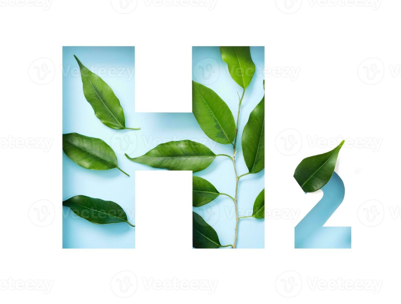 H2 hydrogen icon made of cut paper and green leaves on blue background. Emission-free biofuels concept photo