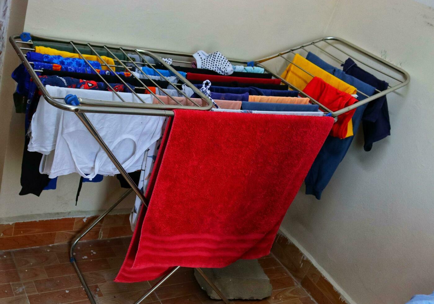 Drying clothes on laundry hanger,balcony cloth drying stand,metal laundry drying rack photo