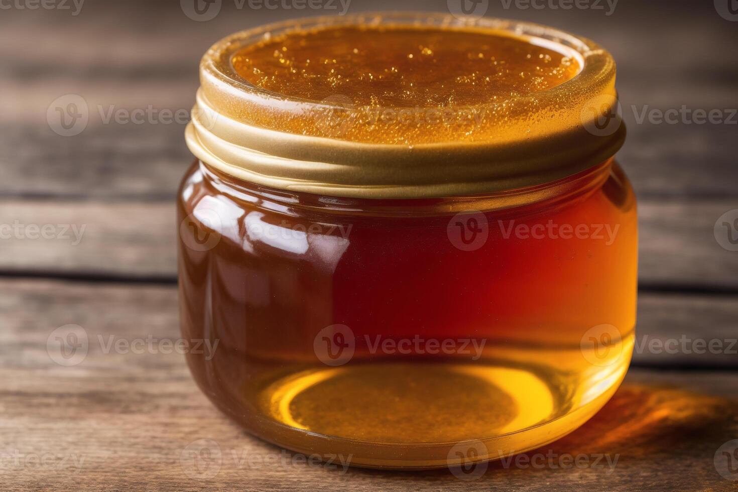 Honey in a glass jar on a wooden background. Selective focus. healthy food concept. photo
