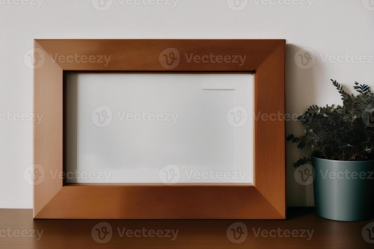 Photo frame on the wooden table. Blank wooden photo frame. Mock up.