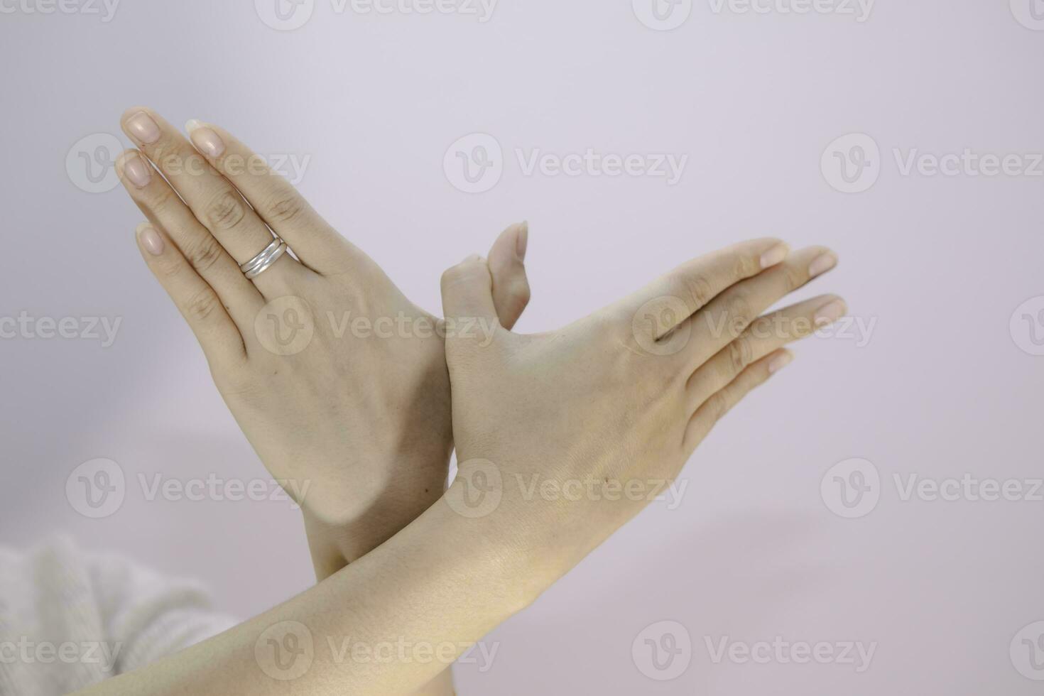 close-up beautiful two hands of a woman showing ten fingers to the back on isolated background photo