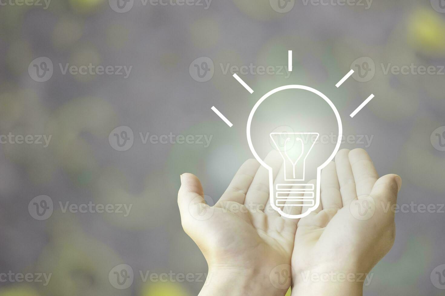 two hand of young business man open with blub  light of idea, sketch light bulb on blur background photo