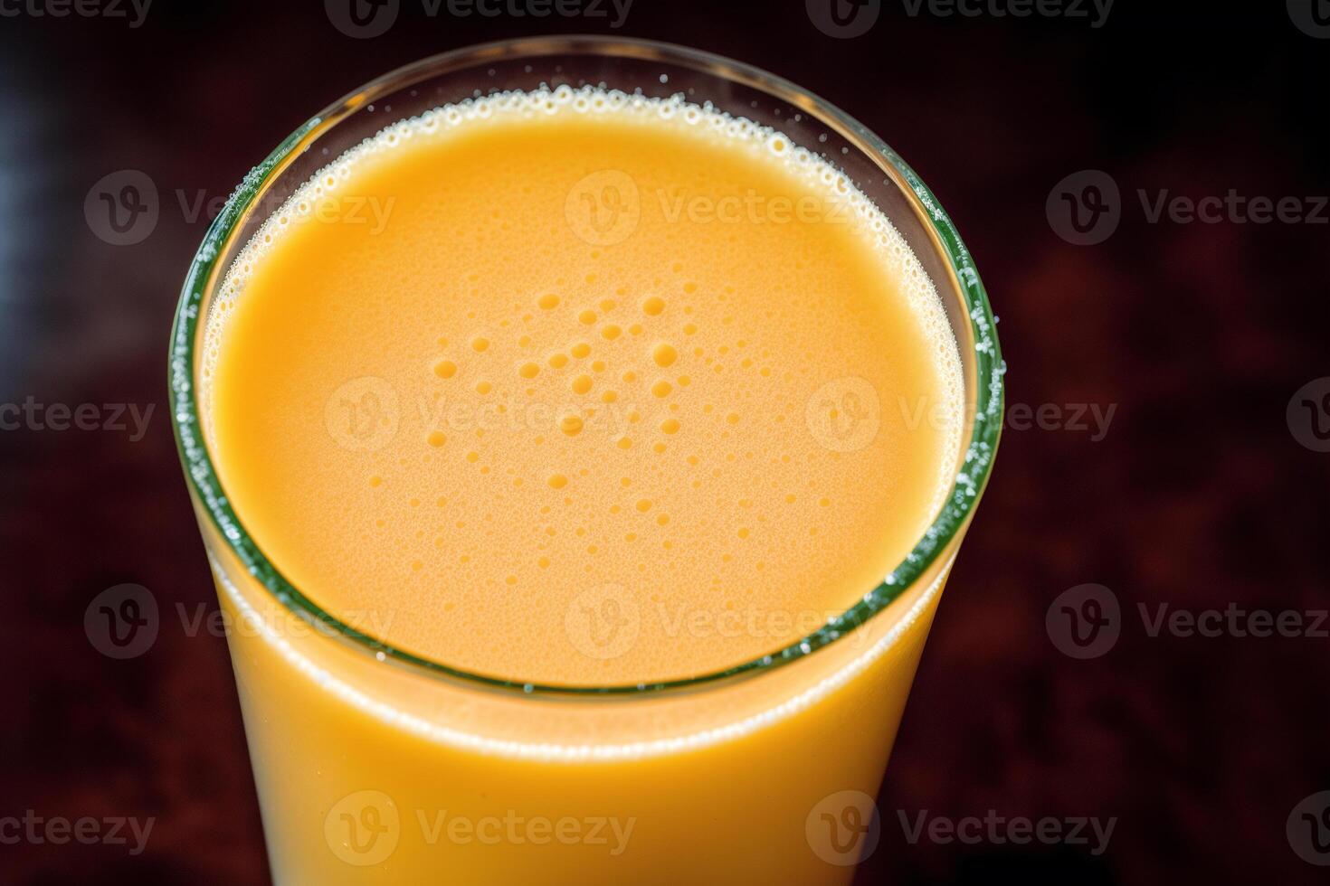 Freshly squeezed orange juice in a glass on wooden table, closeup. Healthy food concept. photo