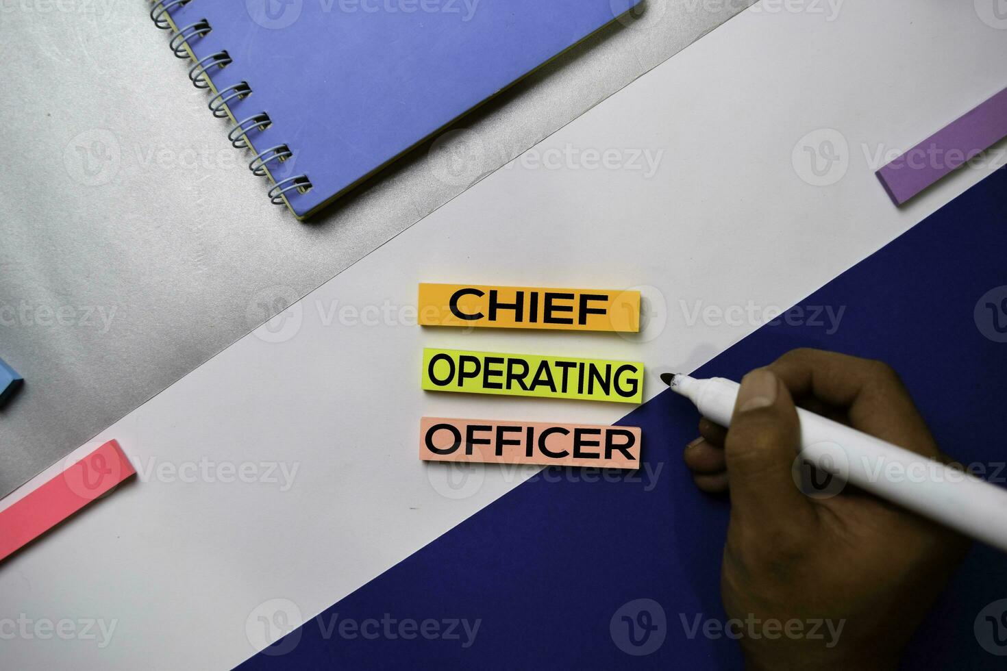 Chief Operating Officer text on sticky notes with color office desk concept photo