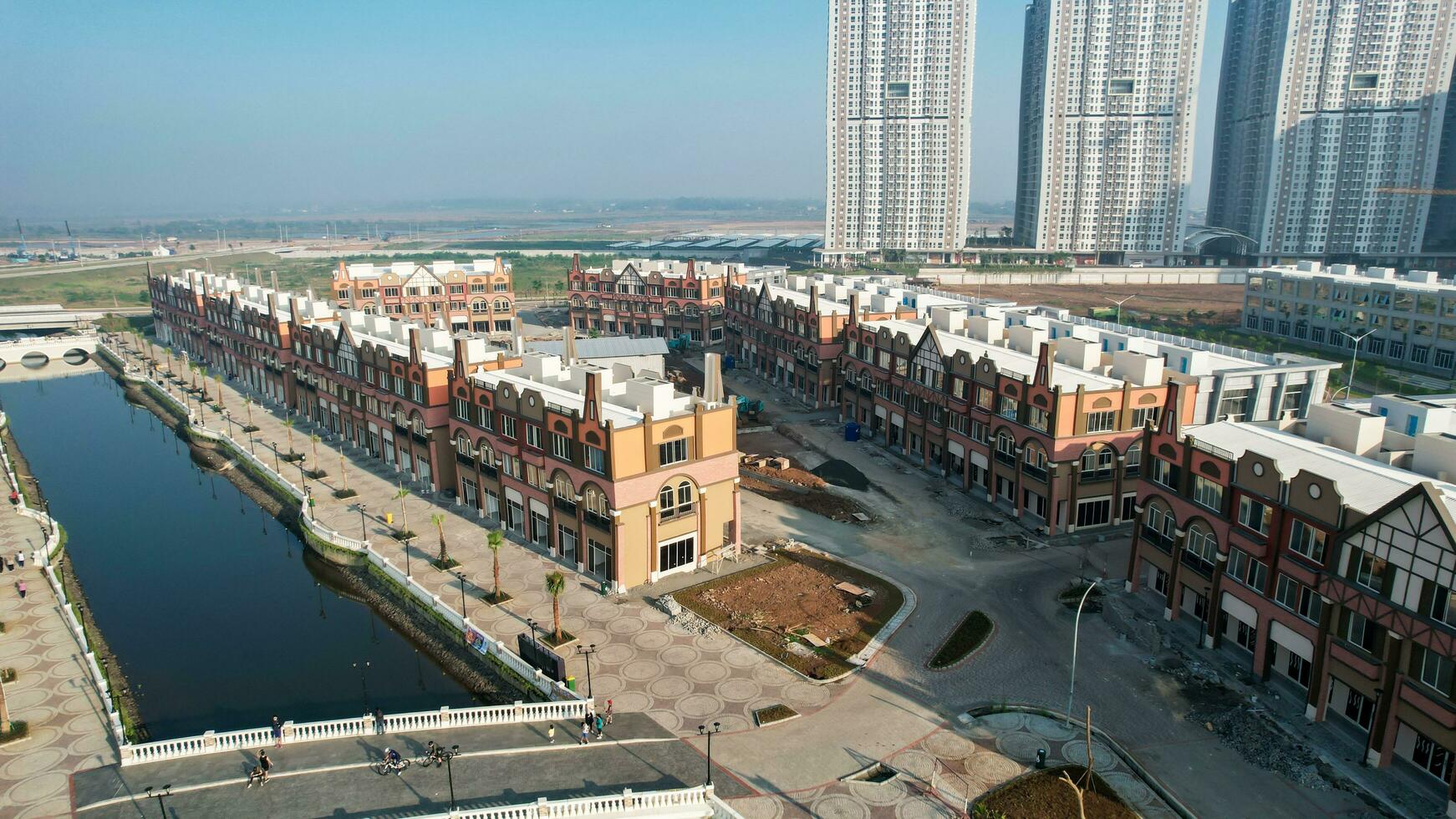 Aerial view of Amsterdam Dutch dancing houses above the southeast of the jakarta river in the spring landscape of the old European city at Pantai Indah Kapuk. Jakarta, Indonesia, June 23, 2022 photo