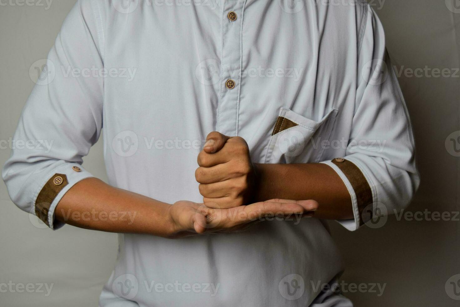 Close up Asian man shows hand gestures it means HELP isolated on white background. American sign language photo
