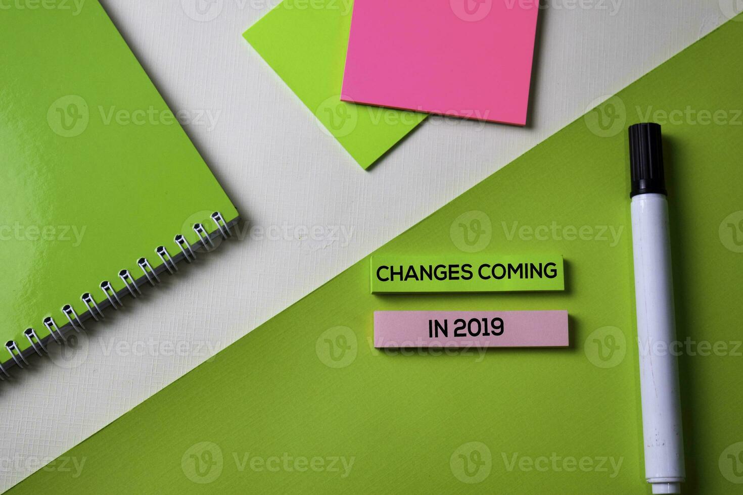 Changes coming in 2019 text on top view office desk table of Business workplace and business objects. photo