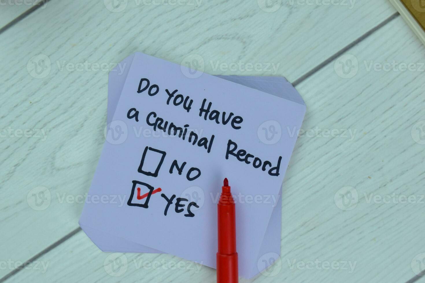 Concept of Yes, Do You Have a Criminal Record write on sticky notes isolated on Wooden Table. photo