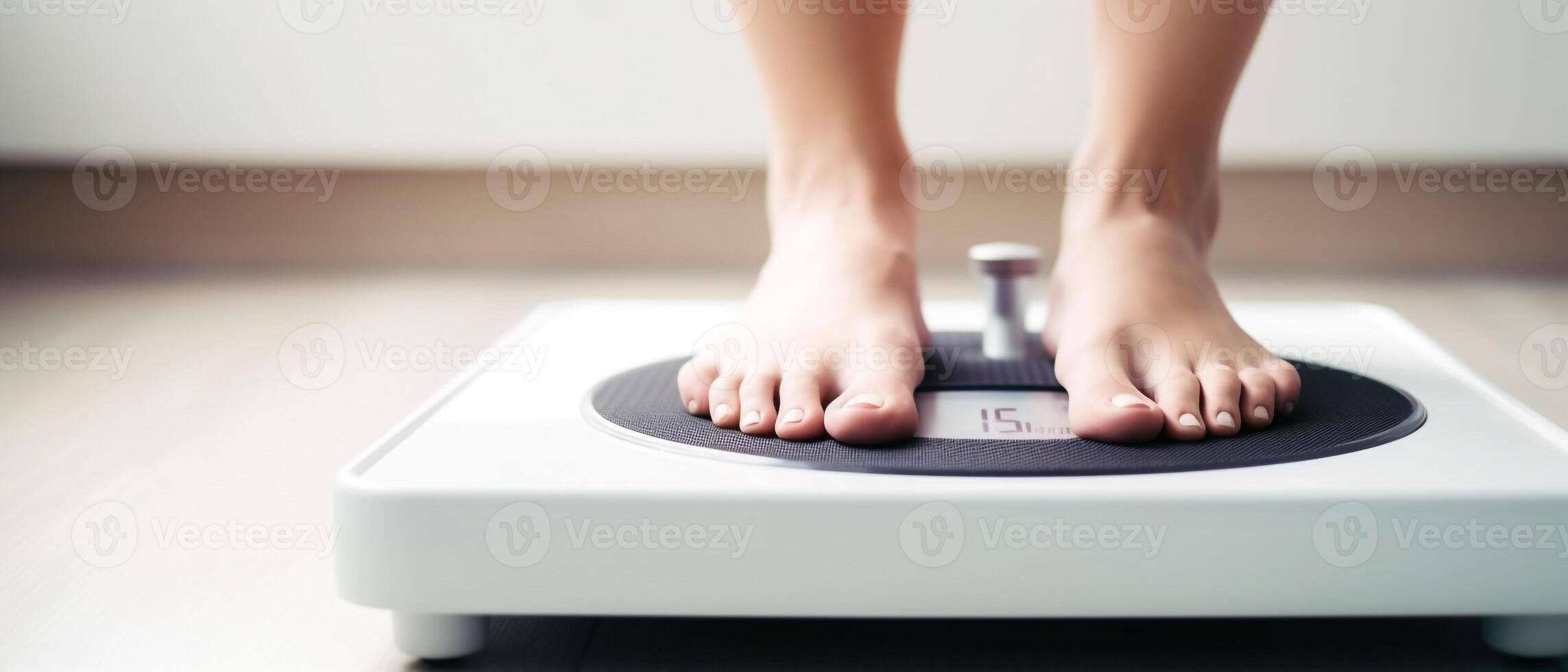 women feet on the weight scales photo