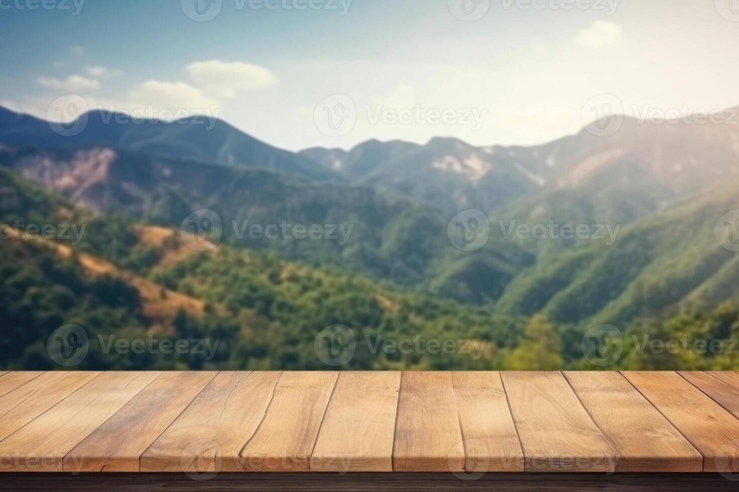 Empty wooden table with blurred mountain landscape background. photo