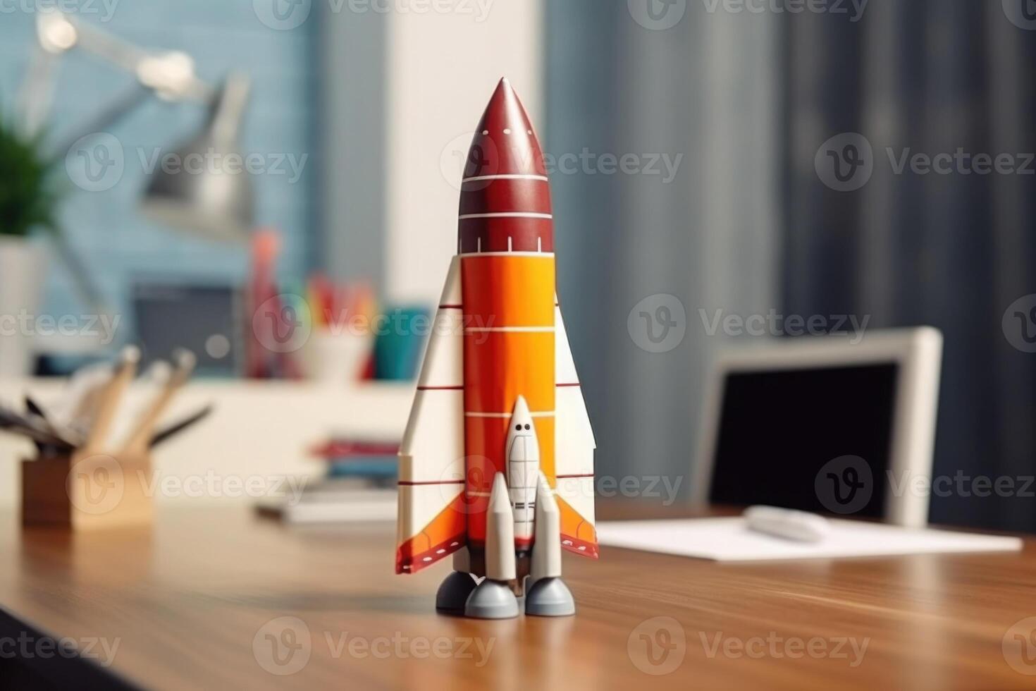 Successful startup concept. Launching rocket on office table. photo