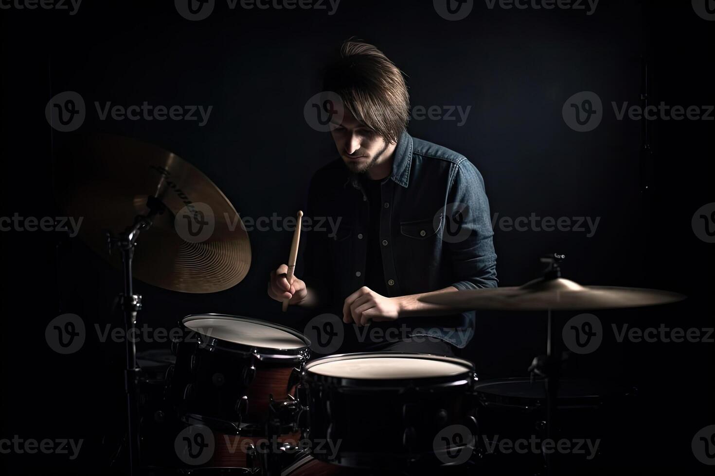 Musician plays drums, drummer on dark background. photo