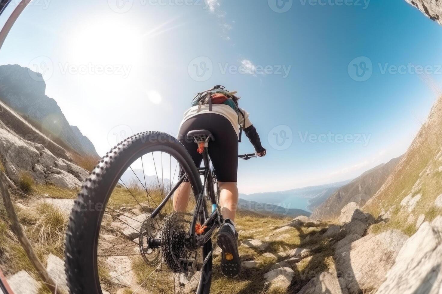 Professional cyclist in protective helmet trains on mountain road. photo