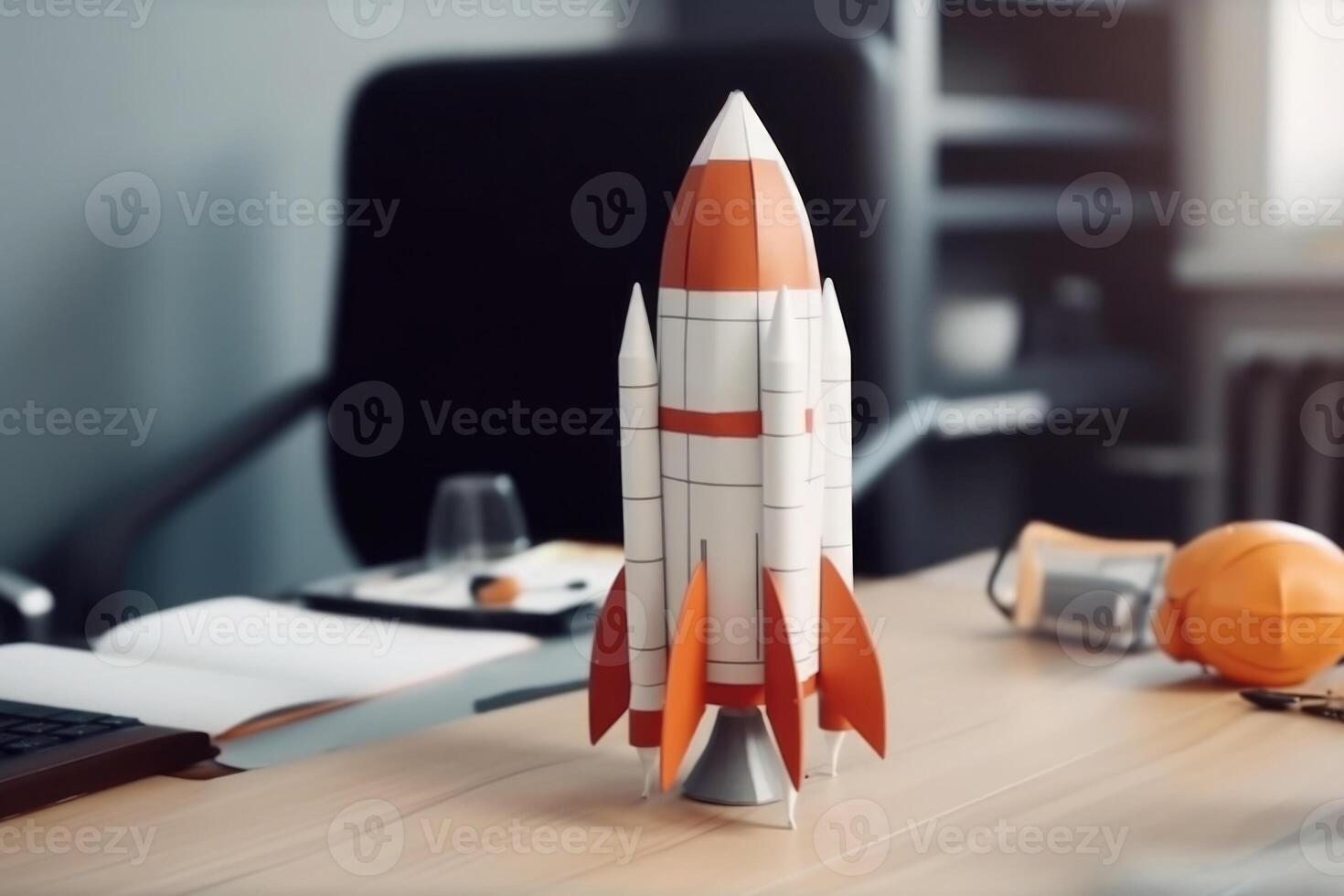 Successful startup concept. Launching rocket on office table. photo