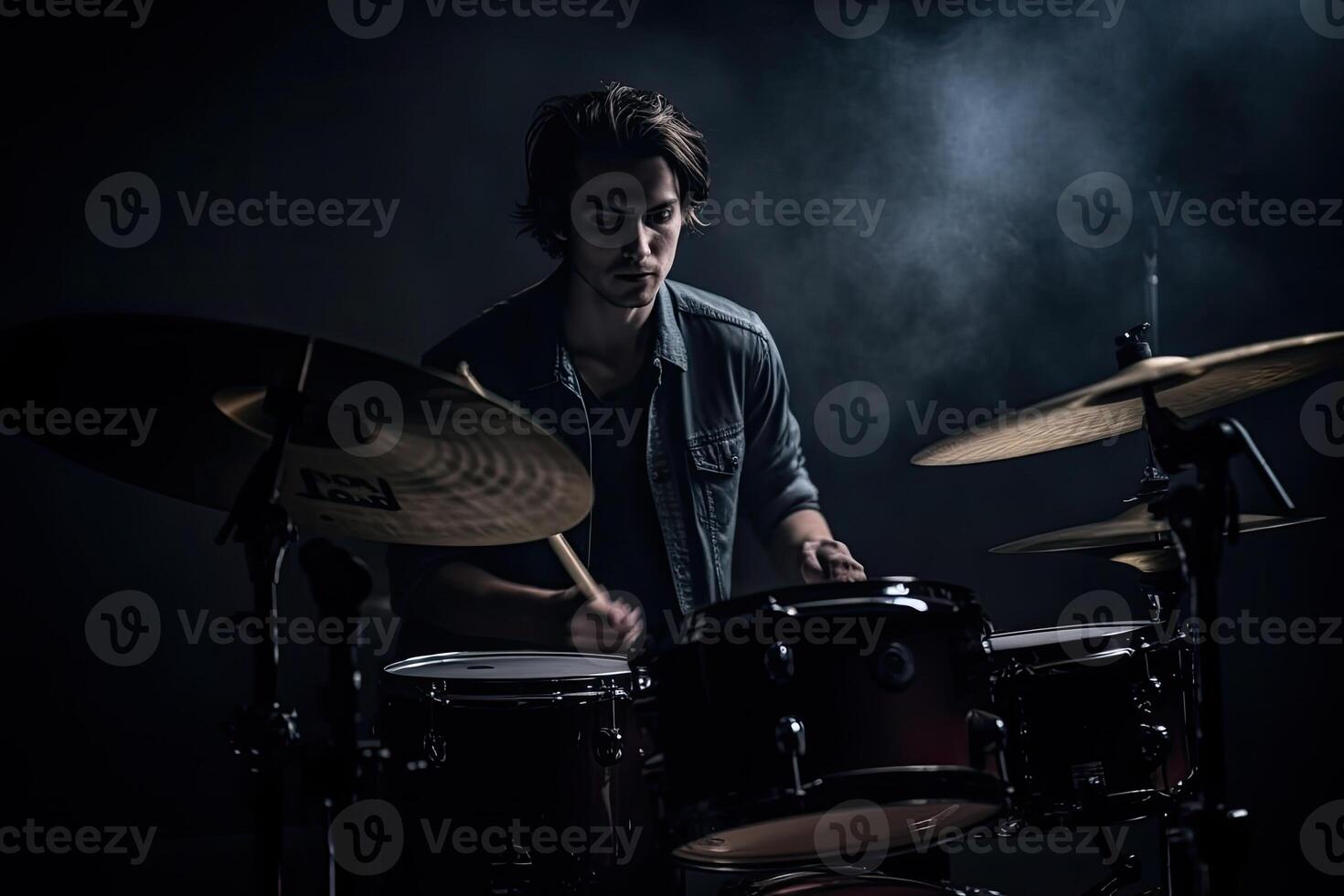 Musician plays drums, drummer on dark background. photo