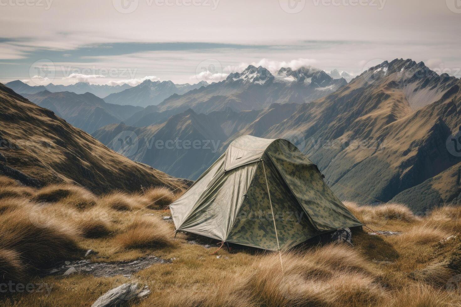 Camping tent with amazing view on mountain landscape at sunset. photo