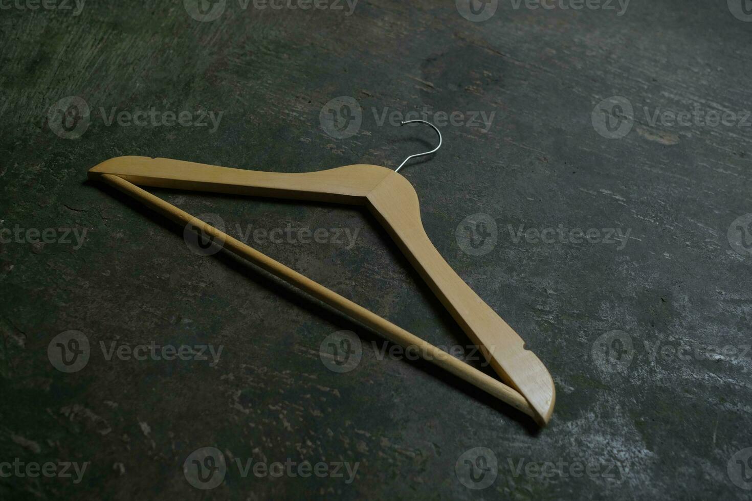 Photo of a wooden clothes hanger on the floor