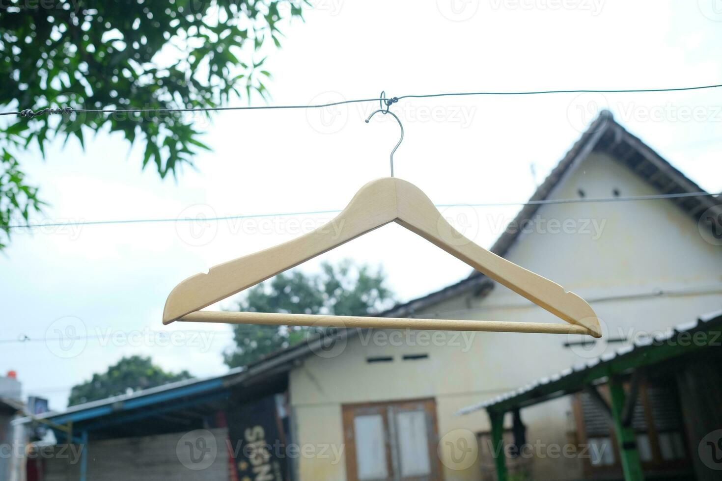 Photo of a wooden clothes hanger on a hanger