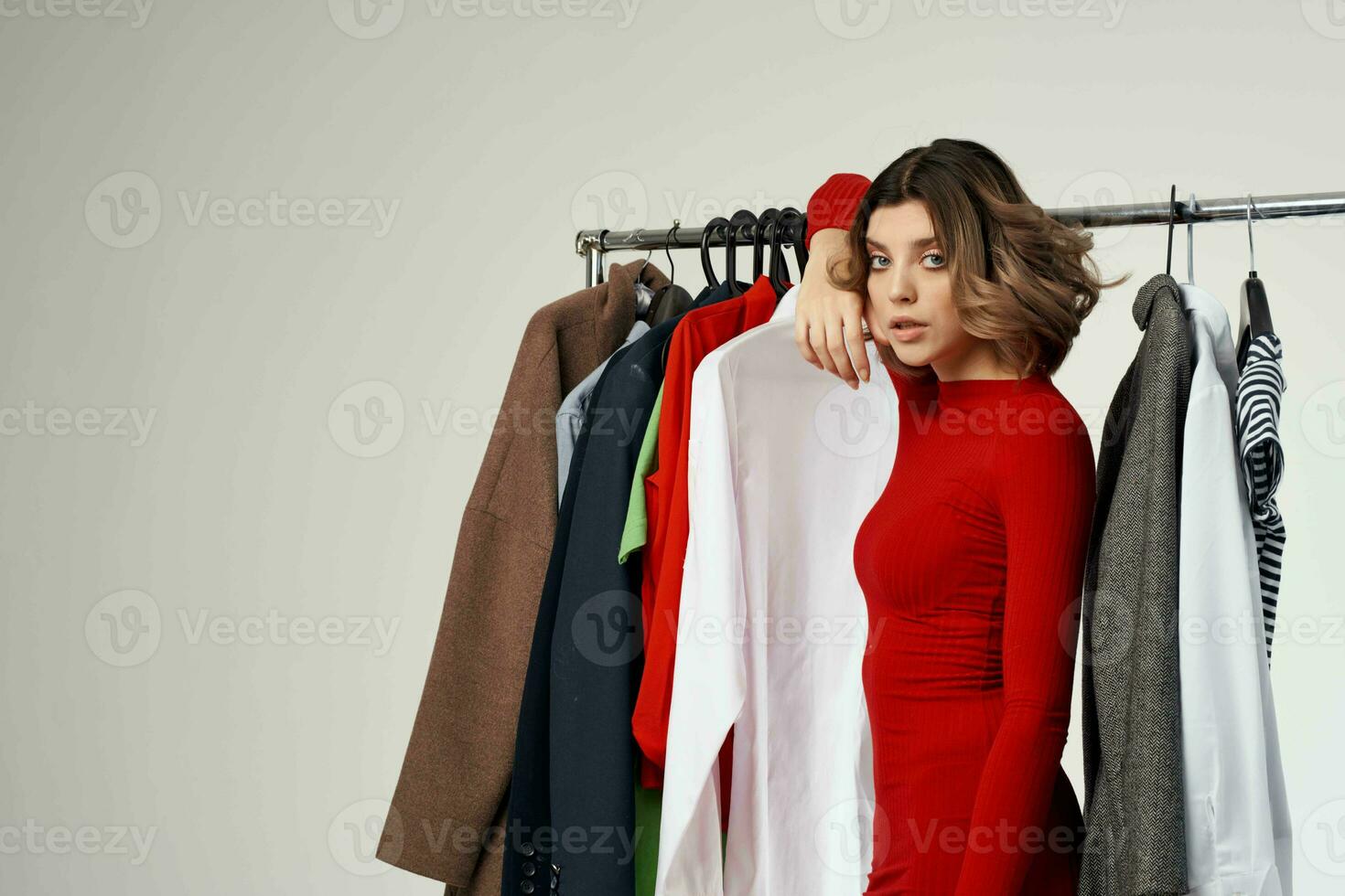 pretty woman trying on clothes shop shopaholic isolated background photo