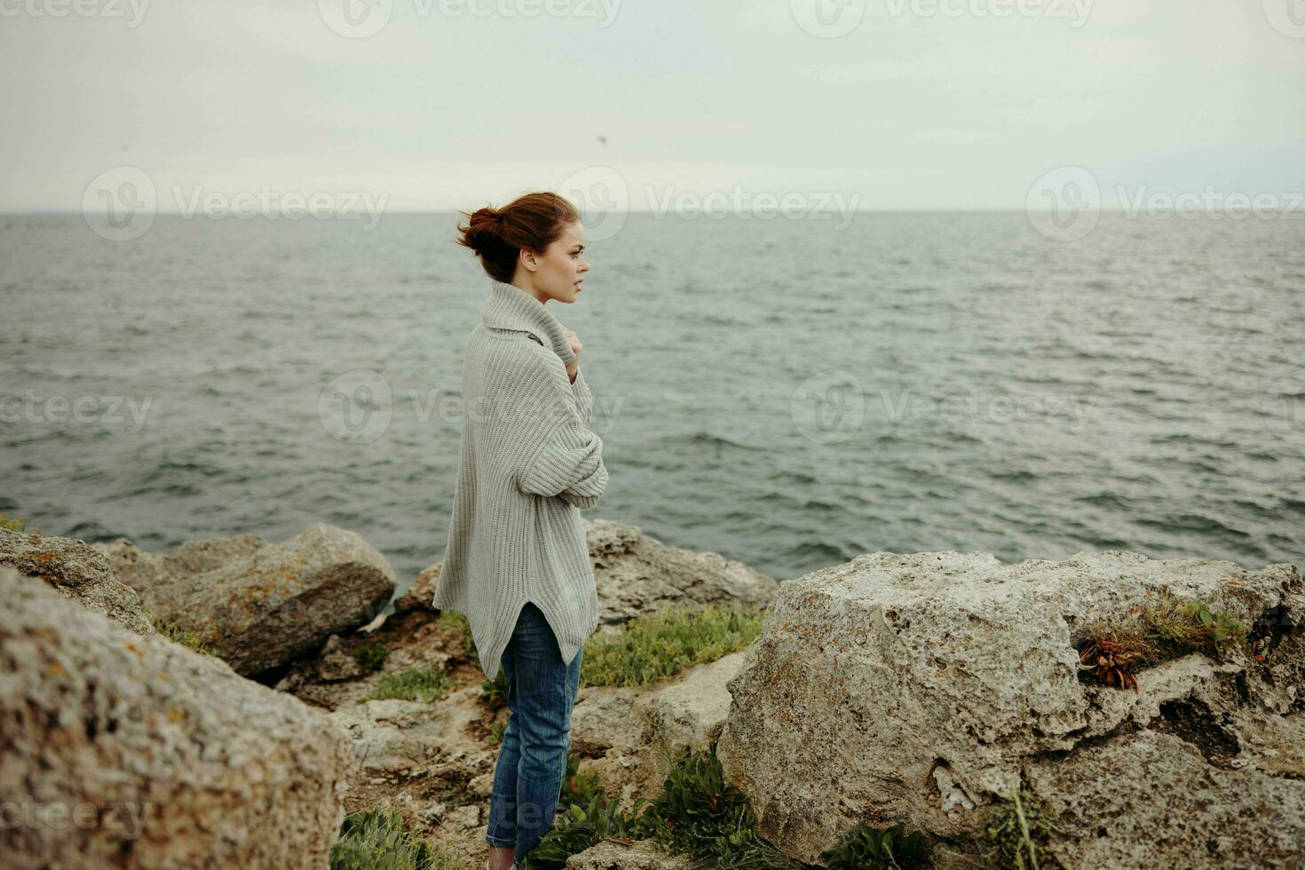 portrait of a woman beach tourism cloudy weather stone coast unaltered photo