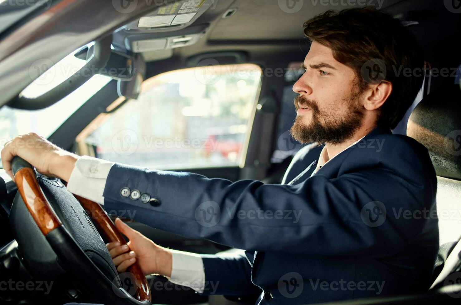 emotional man in a suit in a car a trip to work self confidence photo