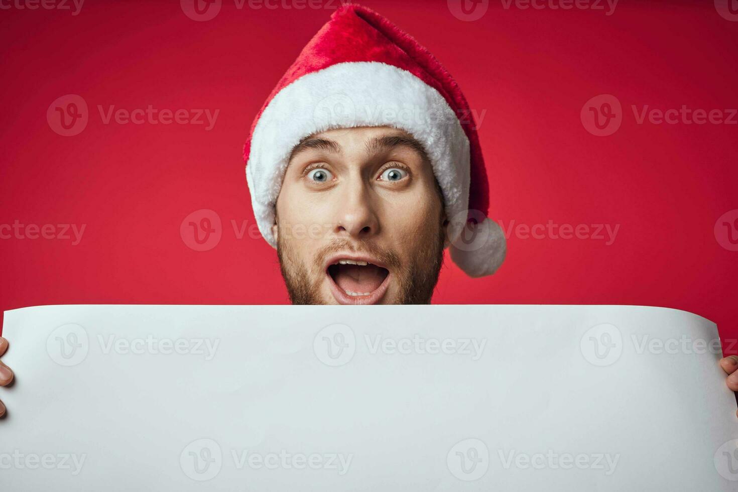 Cheerful man in New Year's clothes advertising copy space isolated background photo