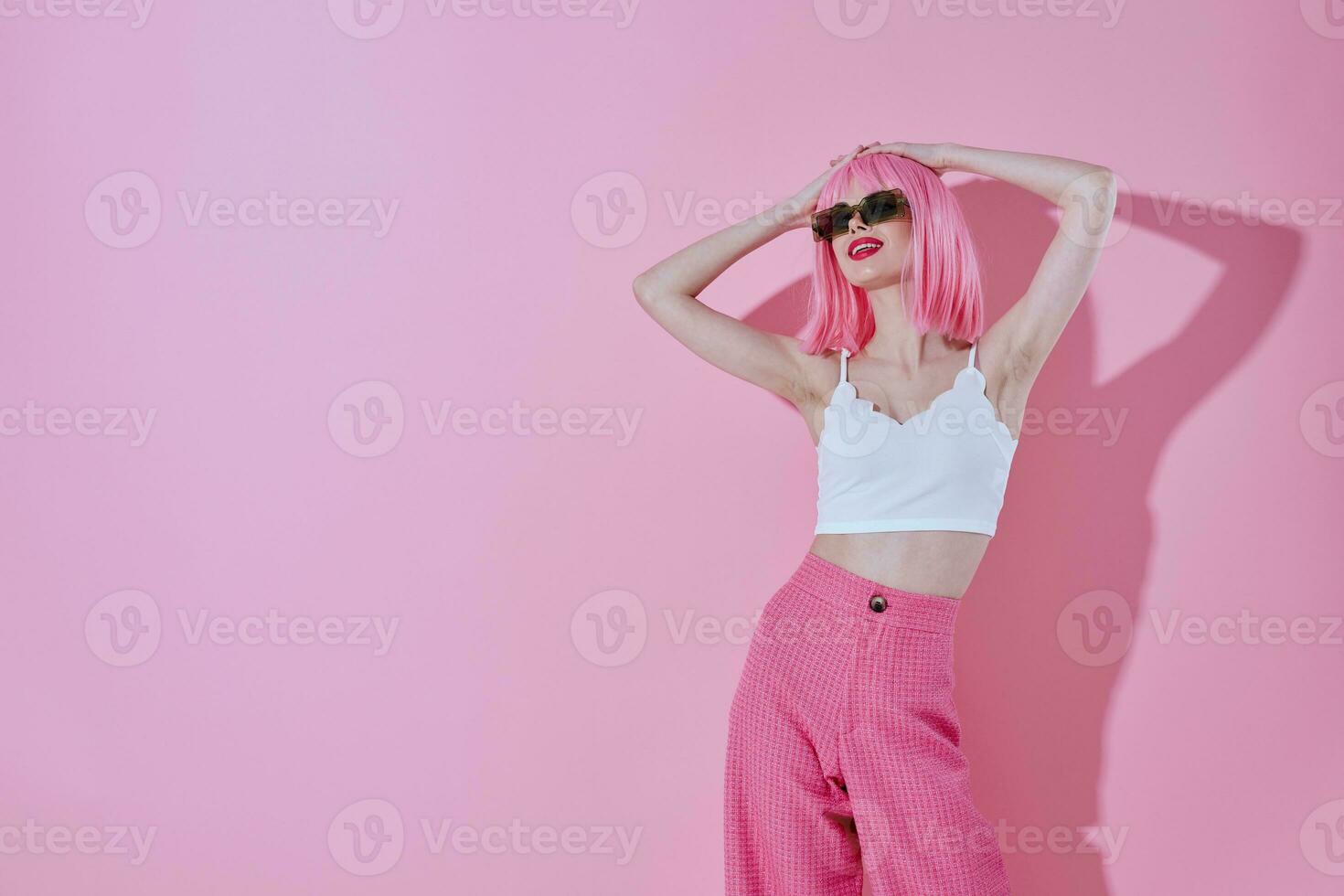 Beauty Fashion woman modern style pink hair Red lips fashion sunglasses color background unaltered photo