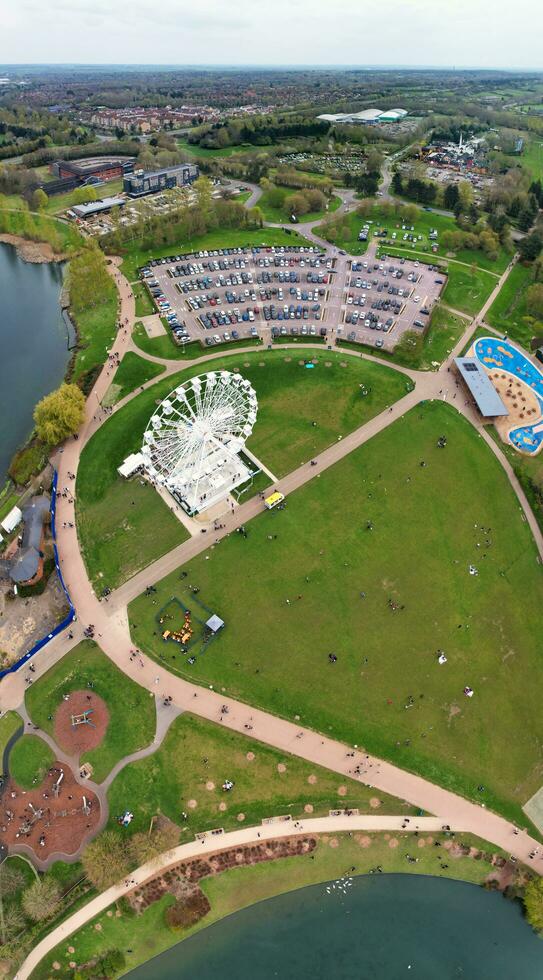 Low Angle View of Willen Lake Park with Local and Tourist Public Enjoying the Beauty of Lake and Park by Walking Around with Their Families. Footage Was Captured on 09-April-2023 at Milton Keynes UK photo