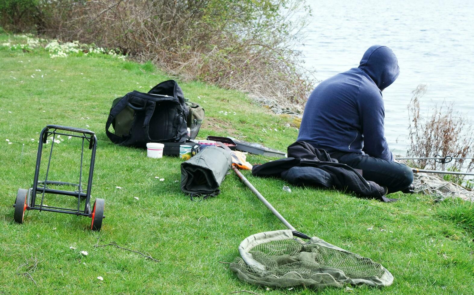 Low Angle View of Willen Lake Park with Local and Tourist Public Enjoying the Beauty of Lake and Park by Walking Around with Their Families. Footage Was Captured on 09-April-2023 at Milton Keynes UK photo