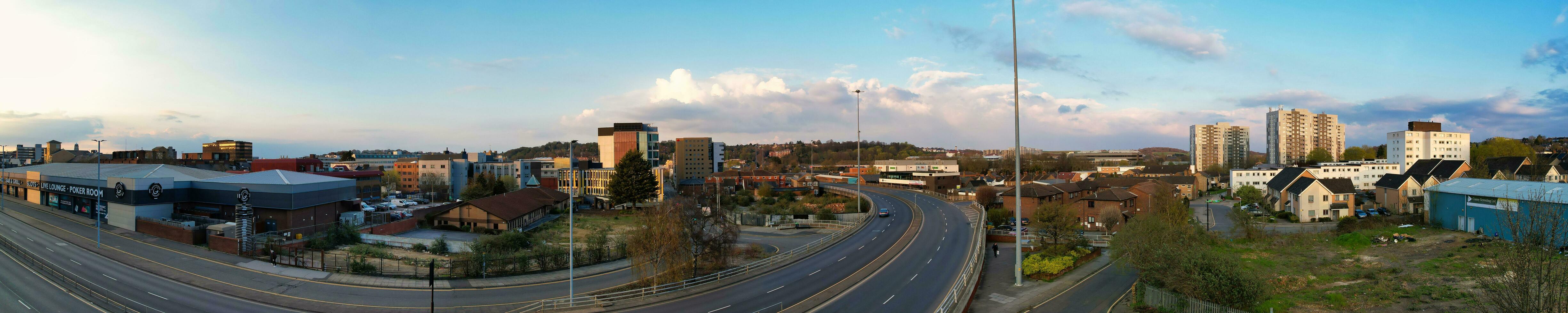 Ultra Wide Panoramic High Angle View of Luton City of England. Aerial View of Town was Captured on 17-April-2023 with Drone's Camera from Low Altitude. photo