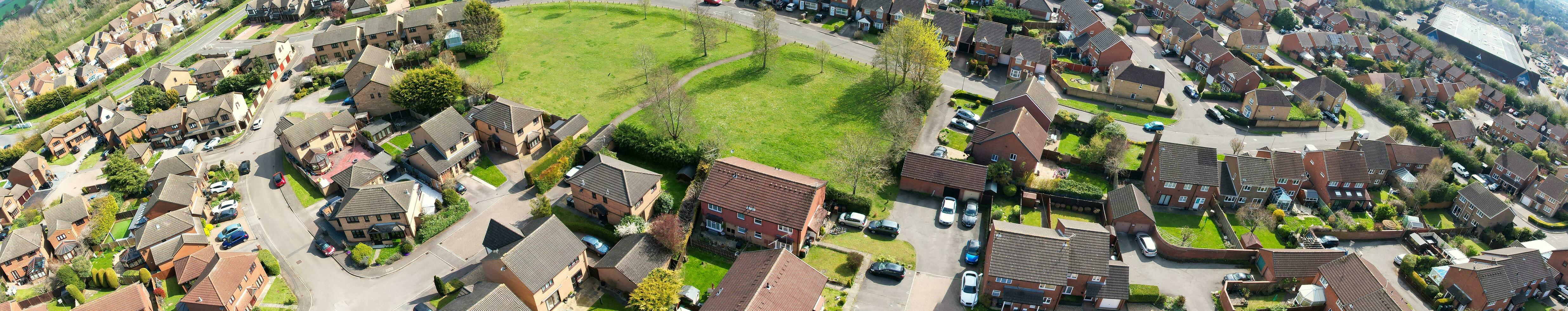 Ultra Wide Panoramic High Angle View of Luton City of England. Aerial View of Town was Captured on 17-April-2023 with Drone's Camera from Low Altitude. photo