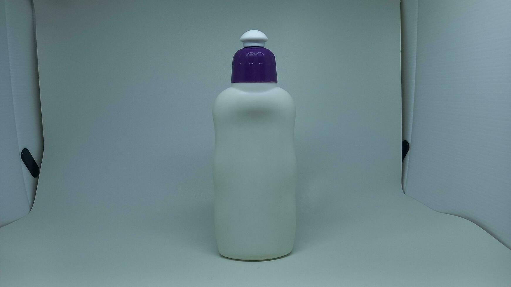 white bottle with blue cap photo