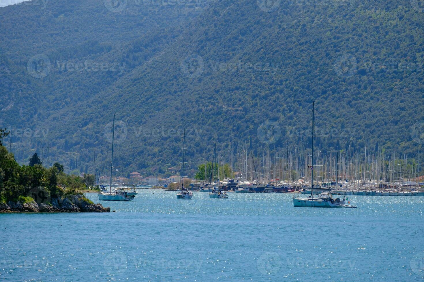 Sailboats in Nydri harbour at Lefkada island, Greece photo