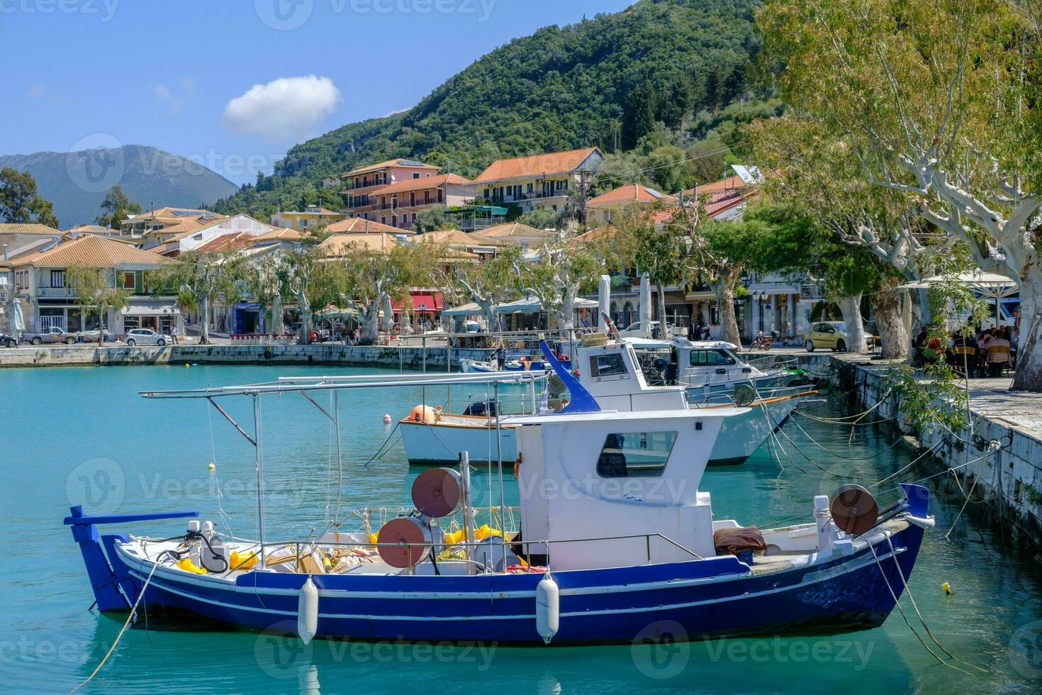 Fishing boats in the harbor at Vasiliki in Lefkada, Greece photo