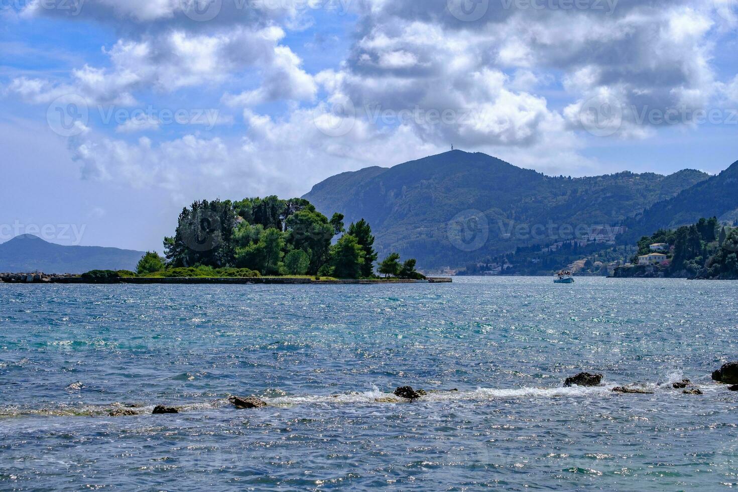 Pontikonis or Mouse island off the coast of Corfu, Greece photo