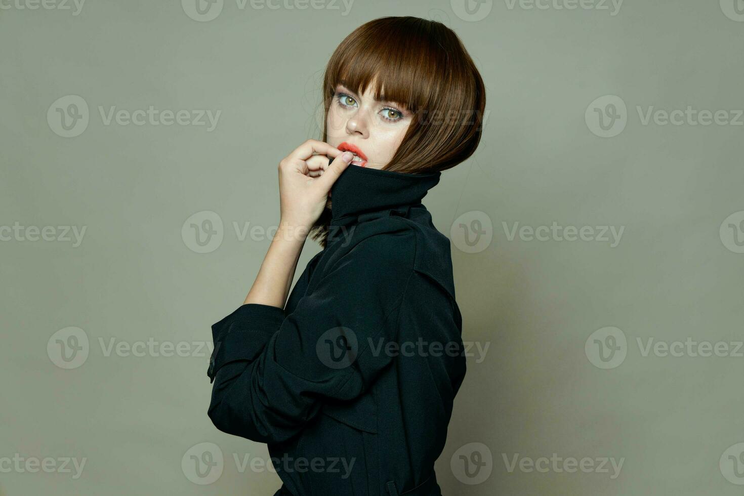 Delightful woman in a black coat and red lips model free place photo