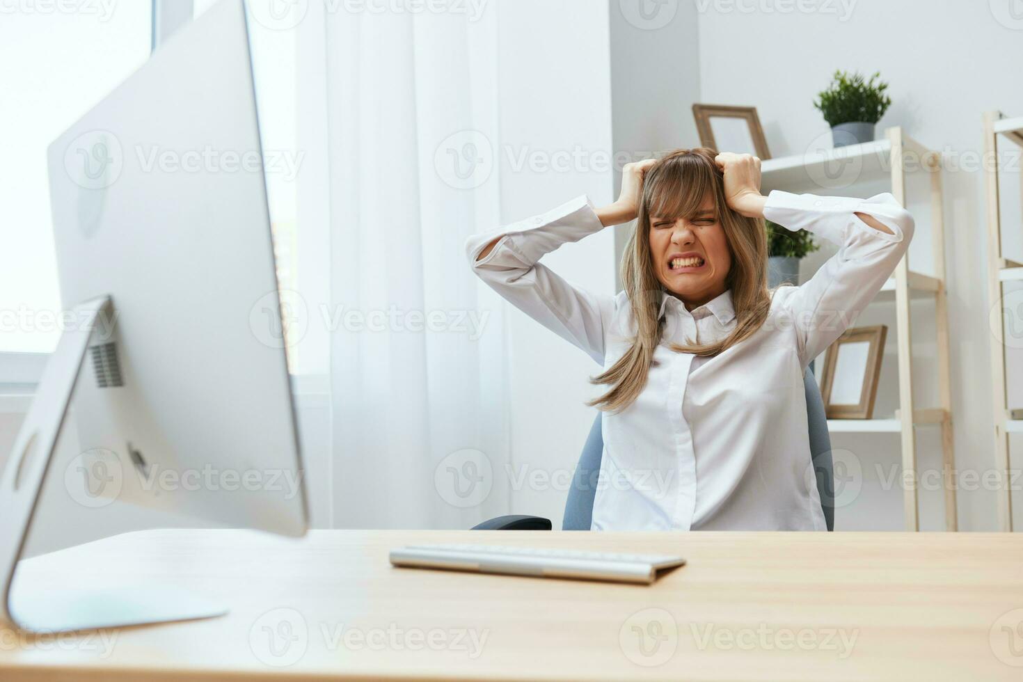 Frustrated adorable blonde businesswoman worker touch head both hands thinking of problem solution in light modern office. Scared employee work on computer online making big mistake. Copy space photo