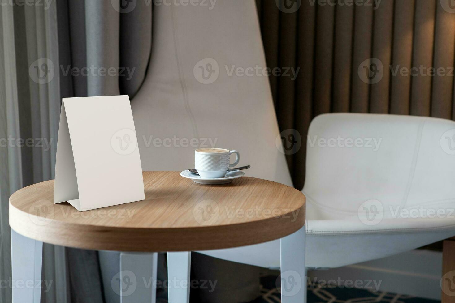 Blank table tent on a wooden table in an office or cafe setting. 3D render illustration photo