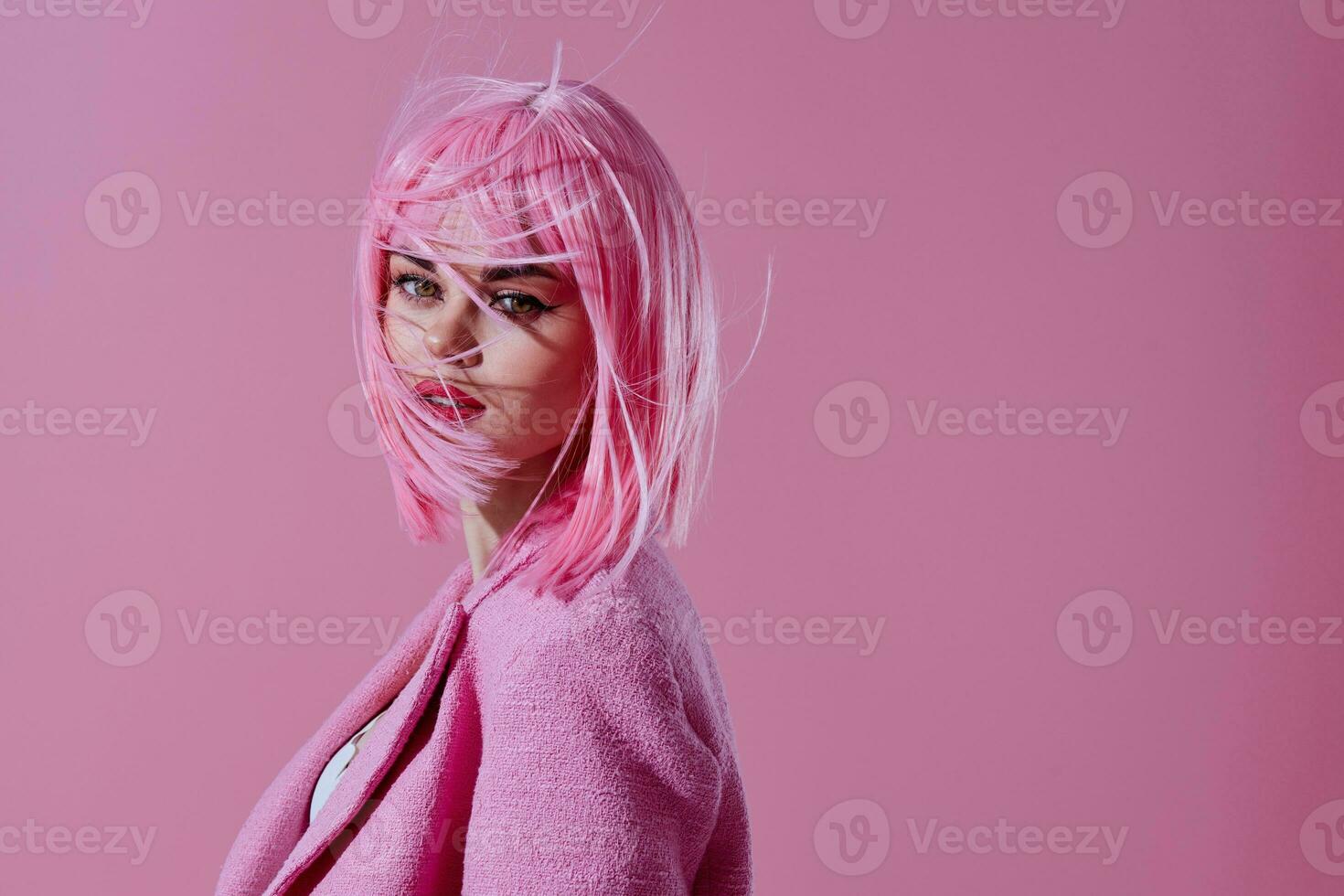 Portrait of a charming lady in a pink blazer pink wig cropped view pink background unaltered photo