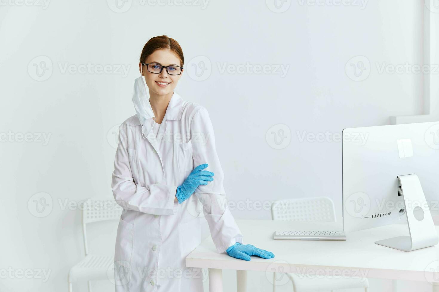 doctor in white coat blue gloves hospital work photo