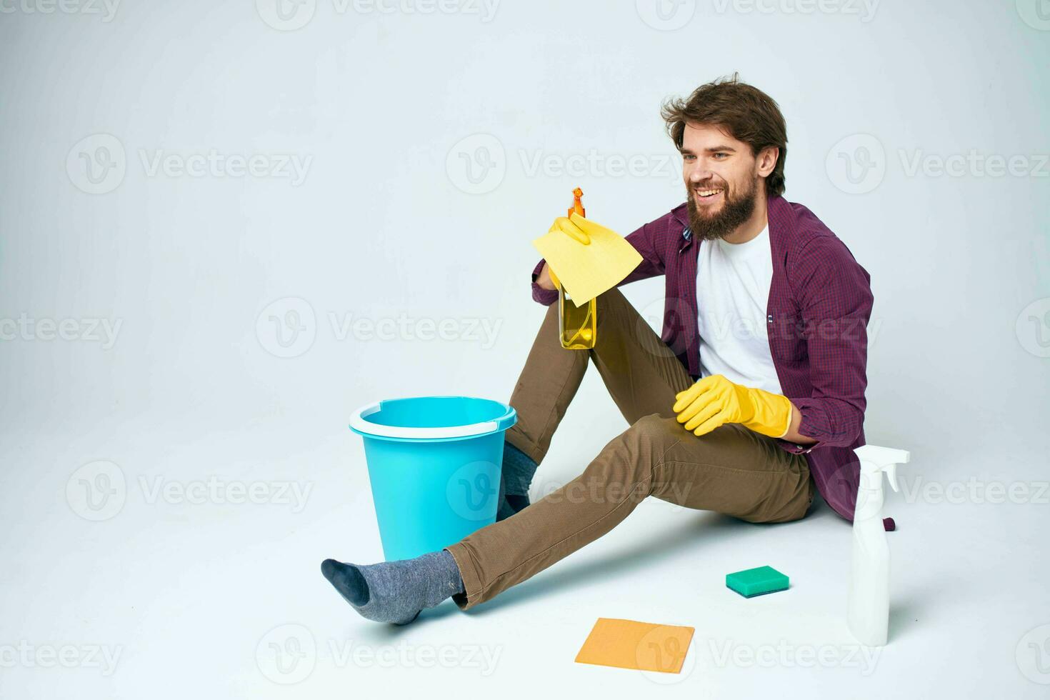 man on the floor with a blue bucket homework lifestyle professional photo