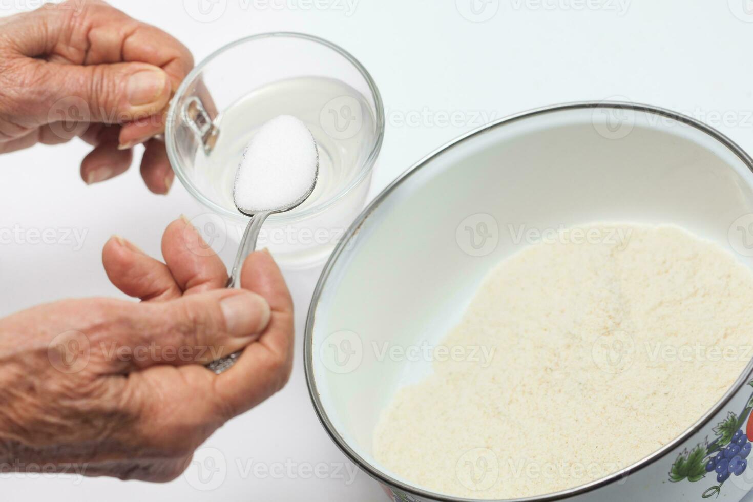 Colombian arepa dough preparation. Add salt to warm water photo
