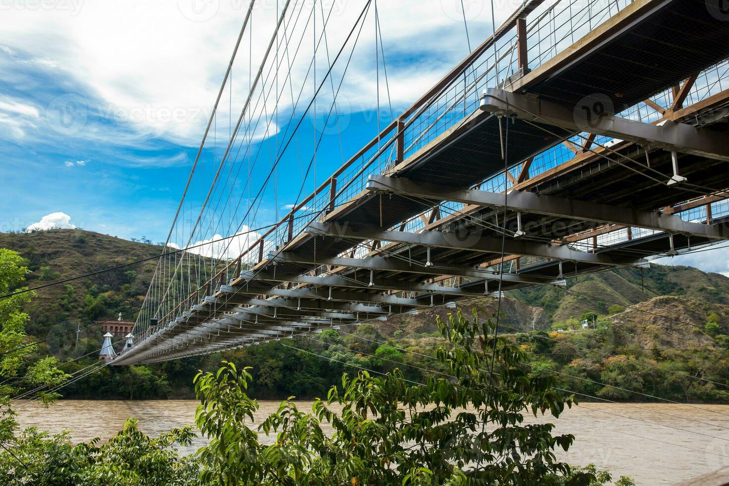 The historical Bridge of the West a a suspension bridge declared Colombian National Monument built in 1887 over the Cauca River photo