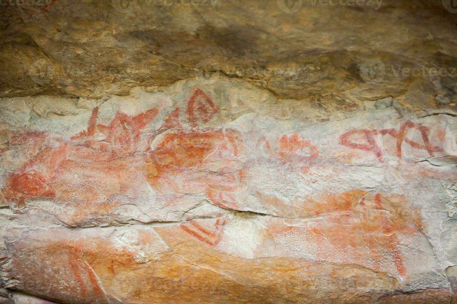 Prehistoric paintings on rock known as petroglyphs in Colombia photo