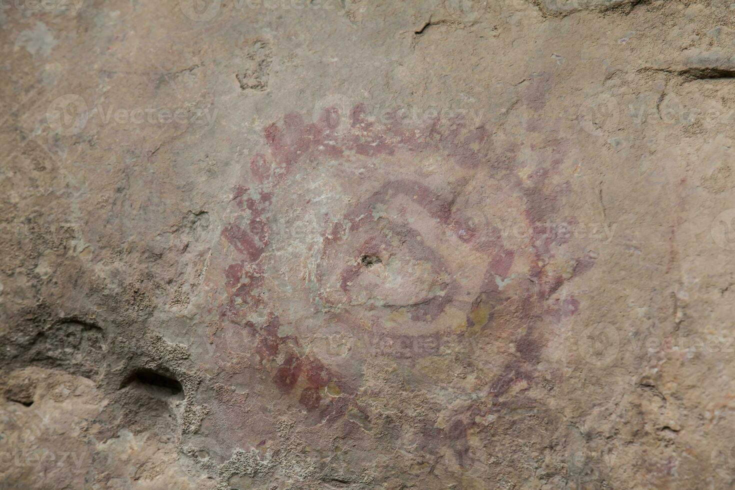 Prehistoric paintings on rock known as petroglyphs in Colombia photo