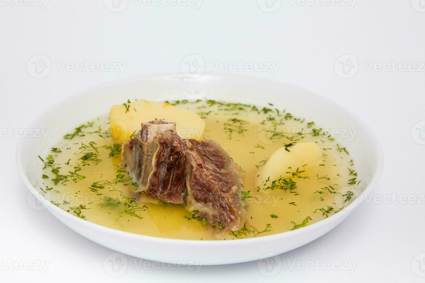 Traditional Colombian beef rib broth isolated on white background photo