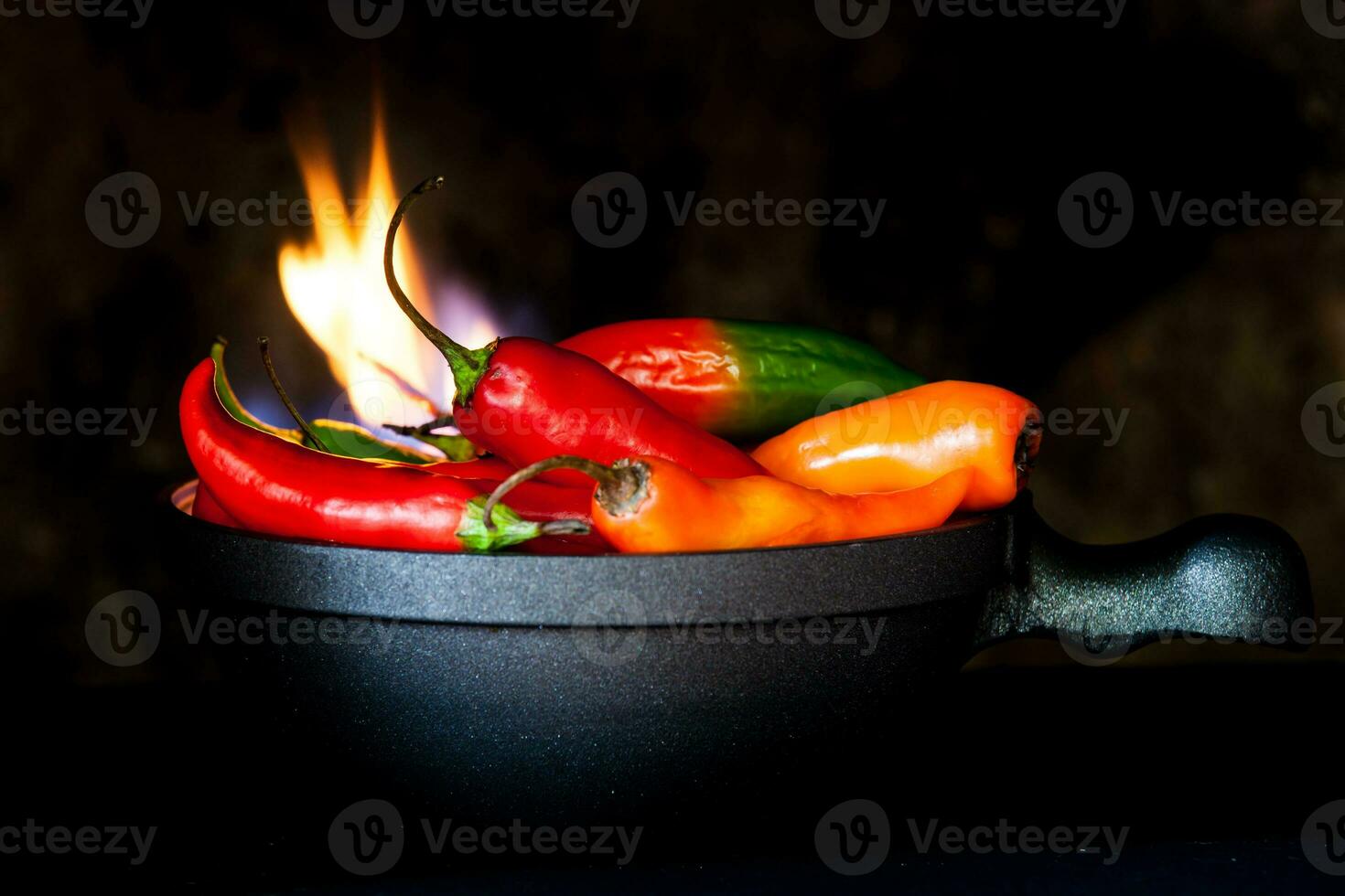 Red hot chili peppers on black background photo